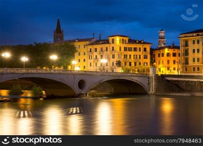 Bridge Ponte Risorgimento and the River Adige at night illumination, Verona, Italy