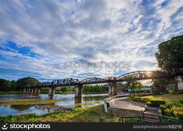 Bridge River Kwai with blue sky and sun in Kanchanaburi, Thailand
