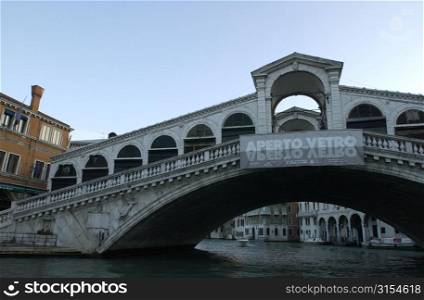 Bridge spanning over a canal in Venice, Italy