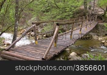 bridge through mountain small river.