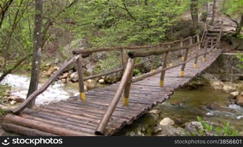 bridge through mountain small river.