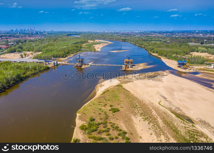 Bridge under construction. Aerial view. Crane