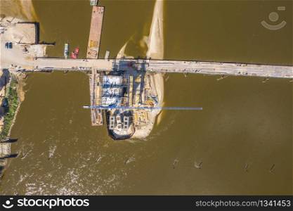 Bridge under construction. Aerial view. Crane