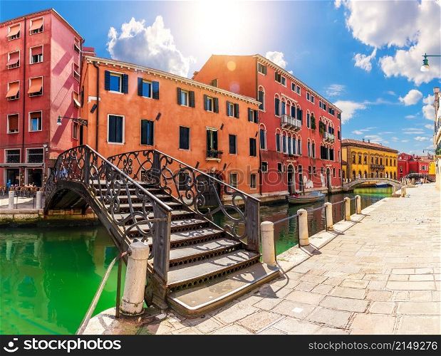 Bridges over Grand Canal and colorful houses of Venice, Italy.. Bridges over Grand Canal and colorful houses of Venice, Italy