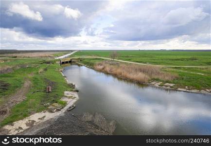 Bridges through irrigation canals. Rice field irrigation system.. Bridges through irrigation canals. Rice field irrigation system