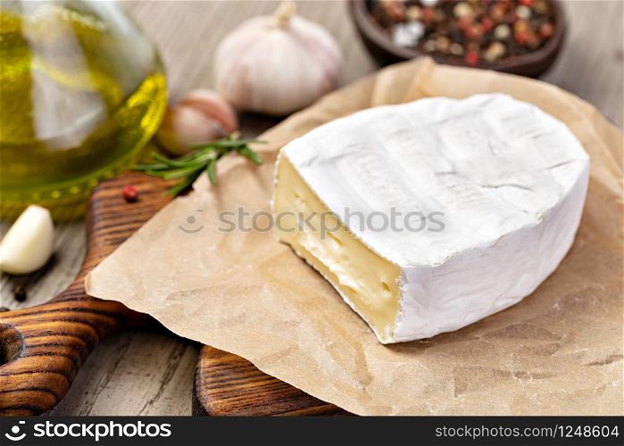 Brie Cheese on wooden background. Brie Cheese