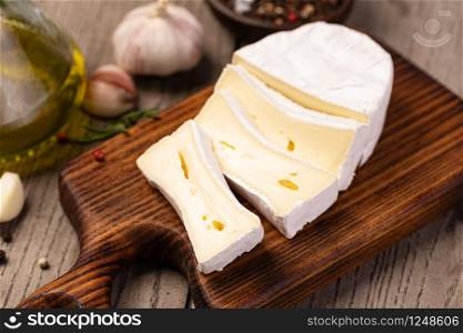 Brie Cheese on wooden background. Brie Cheese