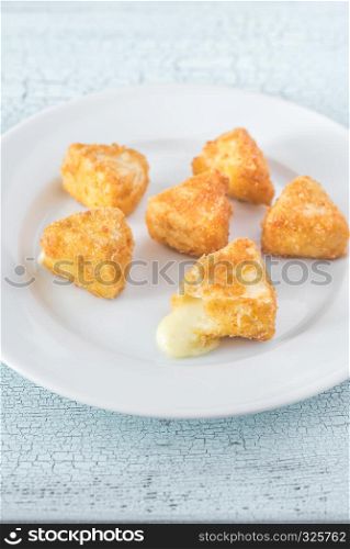 Brie fritters on the white plate