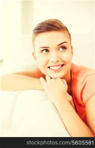 brigh picture of smiling woman lying on the couch