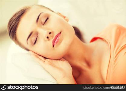 brigh picture of woman sleeping on the couch at home