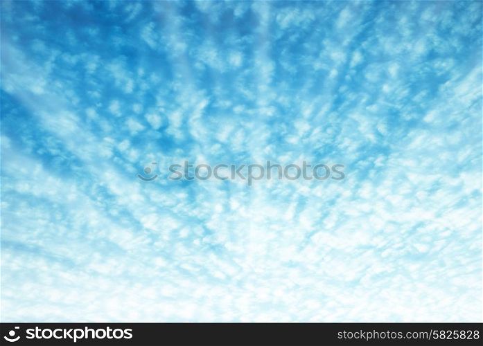 Brighr sun shining on blue sky and texture of white clouds
