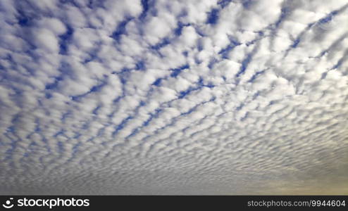 Bright Altocumulus clouds and blue sky in the morning
