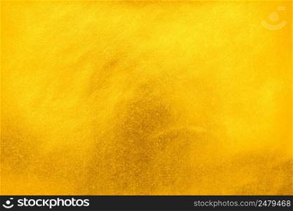 Bright and shiny gold foil paper texture