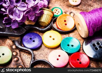Bright assorted buttons in mix colors.Sewing buttons. Thread and sewing buttons