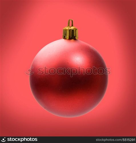 Bright ball for Christmas decoration on red background