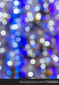 Bright blue bokeh of the lighting of Christmas tree.