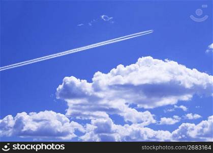 Bright blue sky with whitew floating clouds