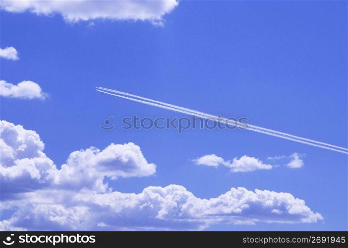 Bright blue sky with whitew floating clouds
