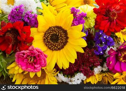 Bright bouquet with fresh fall flowers close up background. Bright fall bouquet