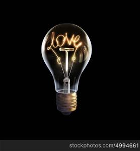 Bright business idea. Glowing glass light bulb with concept inside on dark background