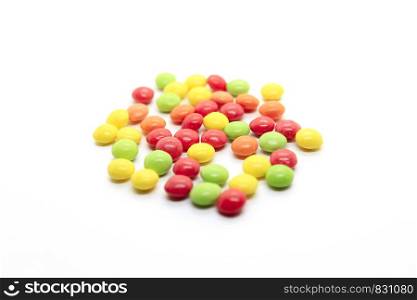 Bright candy in a multicolored glaze isolated on a white background