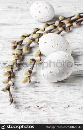 Bright,carved Easter eggs on a background of willow branches