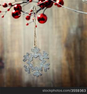 Bright christmas composition with wooden snowflake