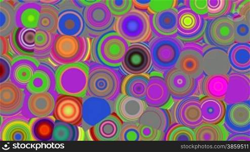 Bright circles slowly rotate changing color
