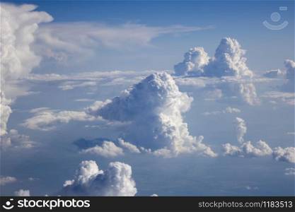 Bright clear blue sky covered white fluffy cumulus clouds in a summer sunny day with copy space. Travel and tourism concept.. Blue sky landscape with big cumulus clouds.