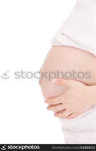 bright closeup picture of beautiful pregnant woman belly