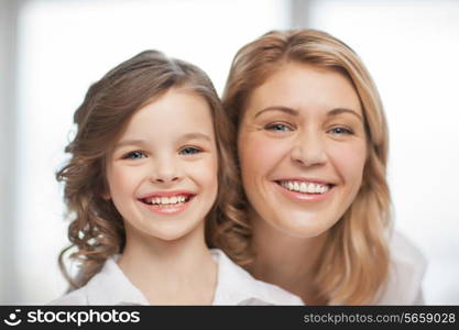 bright closeup picture of mother and daughter