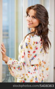 bright closeup picture of smiling woman at home