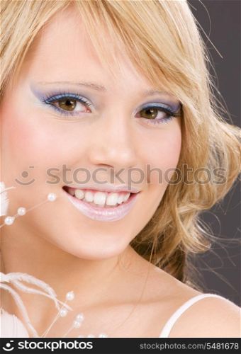 bright closeup picture of teenage girl with feather
