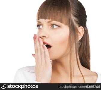 bright closeup picture of woman with hand over mouth.