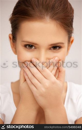 bright closeup picture of woman with hand over mouth