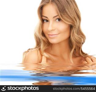 bright closeup portrait picture of beautiful woman in water