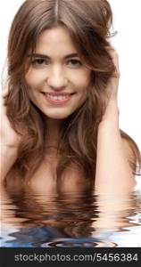bright closeup portrait picture of beautiful woman in water