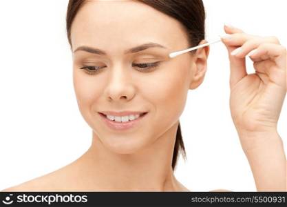 bright closeup portrait picture of beautiful woman with cotton bud