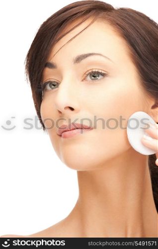 bright closeup portrait picture of beautiful woman with cotton pad