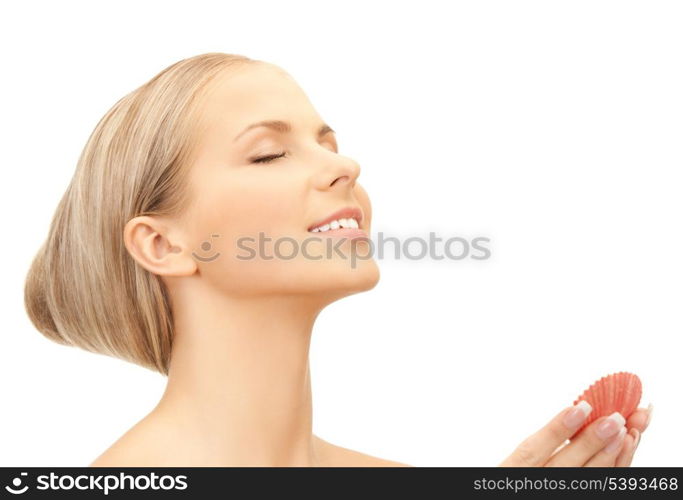 bright closeup portrait picture of beautiful woman with seashell..