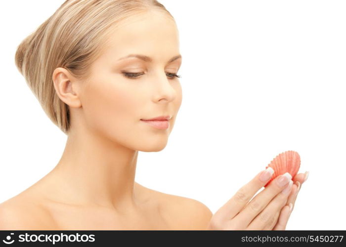bright closeup portrait picture of beautiful woman with seashell..