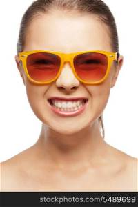bright closeup portrait picture of funny teenage girl in shades