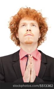 bright closeup portrait picture of praying businessman