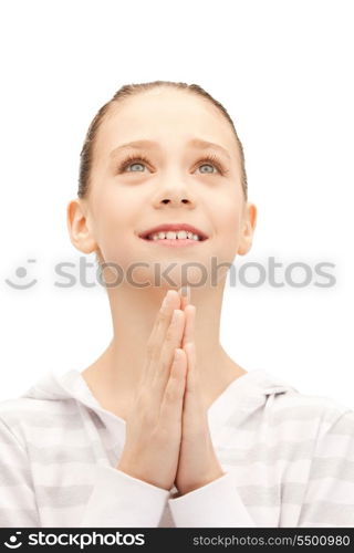 bright closeup portrait picture of praying teenage girl