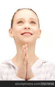 bright closeup portrait picture of praying teenage girl