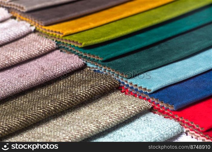 Bright collection of colorful textile s&les. Fabric swatches, set in different colors for selection. Variety colors of upholstery material for furniture and interior. Fabric texture background