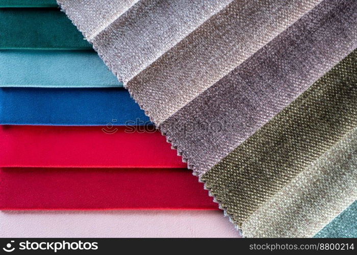 Bright collection of colorful textile samples. Fabric swatches, set in different colors for selection. Variety colors of upholstery material for furniture and interior. Fabric texture background