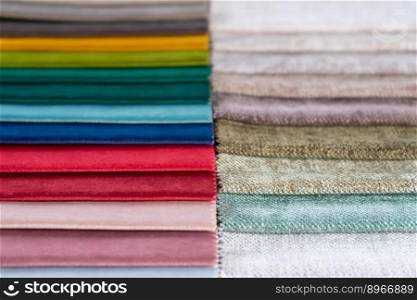 Bright collection of colorful textile samples. Fabric swatches, set in different colors for selection. Variety colors of upholstery material for furniture and interior. Fabric texture background