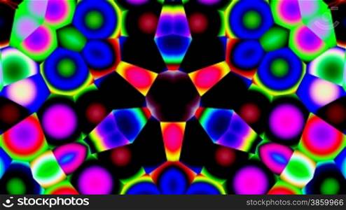 Bright color circles and rings slowly change in a kaleidoscope.