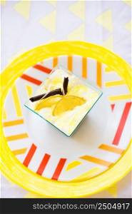 bright colored dessert plate and a yellow napkin. dessert on a plate